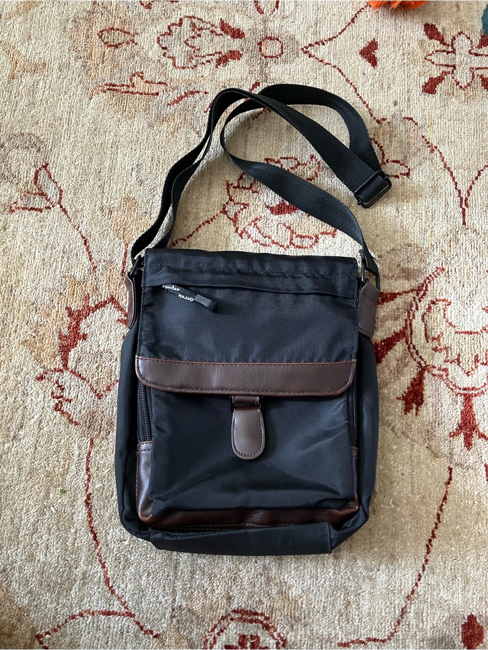 Stylish Black Crossbody Bag with Brown Trim - Unbranded